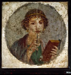 Portrait of Sappho, Greek poetess. Roman woman with book and pen, from Pompeii, Naples, Italy