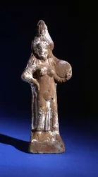 Statuette of the goddess Isis holding a tympanon