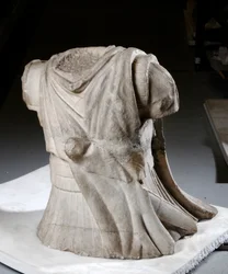 Sculpted torso of a cavalryman with heavy worn cloak