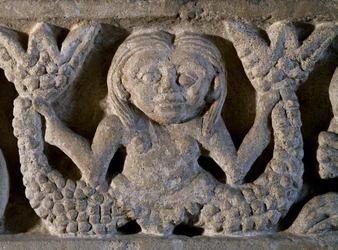 Two-tailed mermaid, detail from Romanesque frieze, Italy