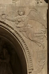 Genius holding a bowl of fruit, symbolising plenty, from a spandrel of an aivans, 590-628