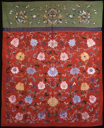A large hanging woven in kossu in coloured silks against a red ground, with an upper border of apple green, Chinese 18th or 19th century