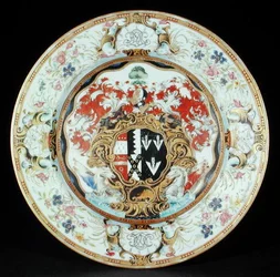 Dinner plate painted in famille rose enamels in the Rococo style with the arms of Leake Okeover Esq., Kangxi period (1662-1722)