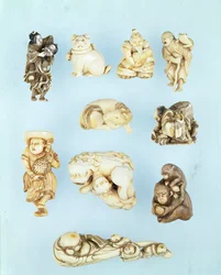 Selection of netsuke: Ikkuha Sennin carrying the Harlot of Benares; seated puppy; Abe no Yasuneri holding a baby; Gamma Sennin; recumbent horse; warrior subduing a runaway ox; standing Dutchman holding a long-tailed cockerel; seated ape holding a peach