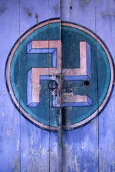 Symbol of Buddhism on one of the gates of the temple 