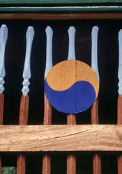 Yin and Yang Symbol on a Wooden Barrier