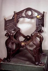 Merovingian art: armchair or throne by Dagobert I. Made in golden bronze in the 7th-9th century. From the treasure of the abbey of Saint-Denis. Paris, B.N.
