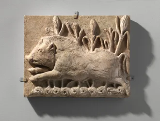 Wall panel with a charging boar, c.6th century AD