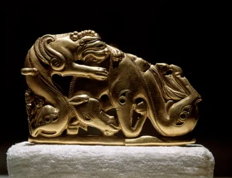 Scythian art: gold belt fibula depicting a griffin attacking a horse. From Chiliktin. 5th-4th century BC
