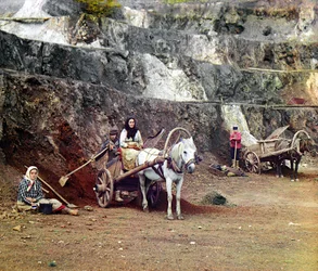 Work at the Bakalskii mine: a family, with shovels and horse-drawn carts, working at the iron mines in the Bakaly hills, Ural Mountains, Russian Empire, 1910