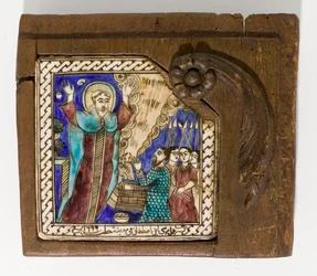 A signed and dated Syrian ceramic tile, painted in manganese, blue and brown, dated 1699