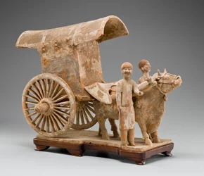 Two-wheeled ox cart with ox and two standing attendants