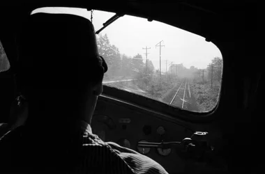 View of Tracks from Cab of a Diesel Locomotive with the Engineer, Pacific Northwest