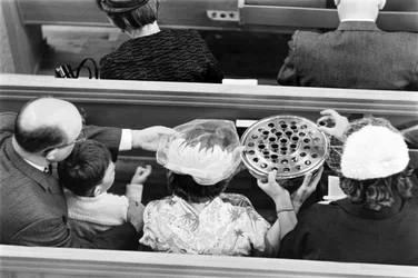 Wine is passed during Communion during a Sunday service at First Congregational Church