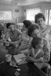 Women at a counter chat over breakfast in a diner in Oregon