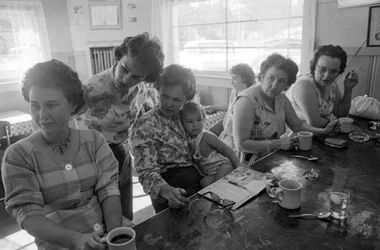Women at a counter chat over breakfast in a diner in Oregon