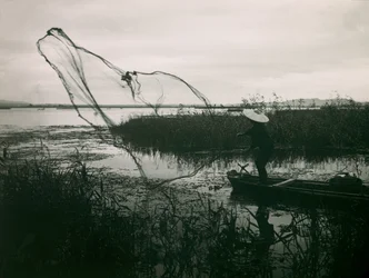 Japanese Fisherman Casting His Nets on a Lake, circa 1900 - 1915