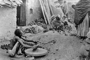 A potter at work, India