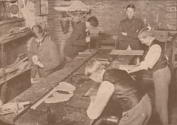 Boys of Harrow School making splints, crutches and other articles for the wounded, c1916