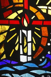 Candle depicted on stained glass, Lome, Togo