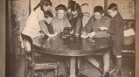 Children emptying their money-boxes to invest in war loan, c1917