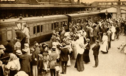 Crowds waving off troops leaving to fight in the First World War, Britain