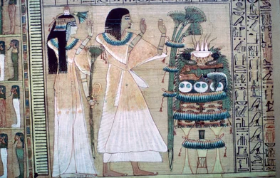 Depiction of a Man and His Wife Making Offerings to Osiris