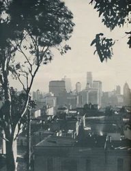Dwellings of Homely Timber in the Shadow of Concrete Giants, c1935
