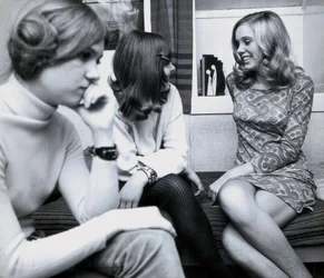 Fashion: Young Girls at a Party in Spain, One of the Women is Wearing a Very Short Dress