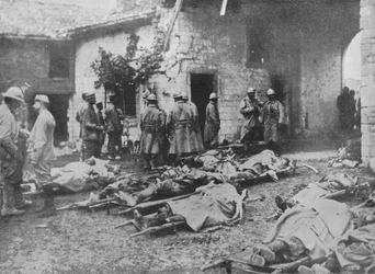 French wounded being removed during an attack to a farm in the rear of the lines, 1915