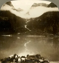 Grytereids Glacier Glittering Above Drifting Clouds, Across Placid Lake Olden, Norway