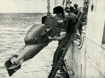 Hoisting a Chariot Manned Torpedo on Board a Ship, World War II