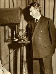 John Logie Baird watching the first play to be televised, 14 July 1930