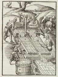 Washing gold ore in wooden trays filled with water - Engraving from Description of ores and main mining methods, by Lazarus Ecker