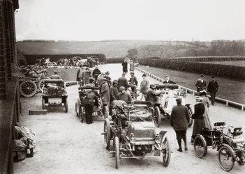 Motor cars parked outside a country house during the 1000 Mile Trial