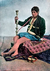Persian woman smoking in Kalgan, c1890