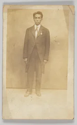 Photographic postcard of a man in a suit, 1904-1918