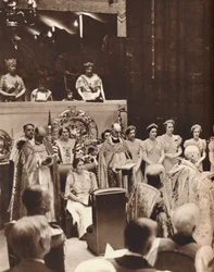 Queen Elizabeth looks on as her husband is crowned on the day of his coronation