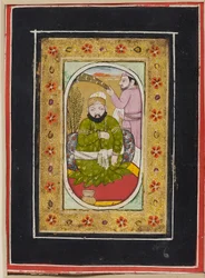 Ruler wearing a green jama attended by a morchal bearer