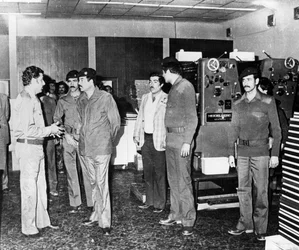 Saddam Hussein visiting a state paper press, Baghdad, Iraq