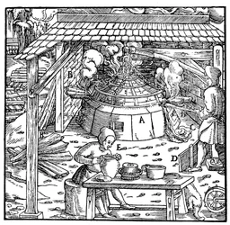 Separating lead from silver or gold in a cupellation furnace, 1556