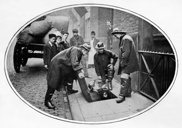 Sewermen going below, London
