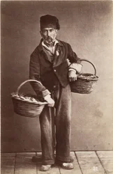 Small metiers: portrait of a fish monger, baskets loads of fish