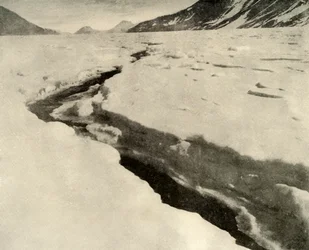 Stream of Running Water in the Middle of the Ferrar Glacier in Midsummer