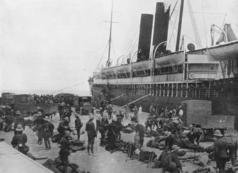 The Dardanelles Expeditionary Force sets out: A transport loading up at Alexandria