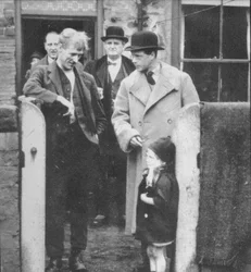 The Prince of Wales visiting a miners cottage in the Northeast of England