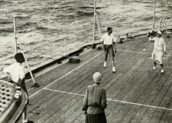 Their Majesties in a Game of Deck Quoits on Deck of H.M.S. Renown, 1927