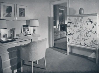 W. & J. Sloane. Photographers hobby room showing a desk in natural oak, a hand-woven covering on the table