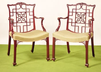 Chippendale mahogany dining chairs in the Chinese taste, top rails surmounted by a ducal coronet and griffon crest, c.1760
