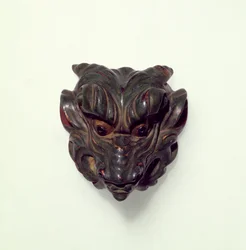 Painted boxwood netsuke, carved as a model of a Gagaku Mask, 19th century